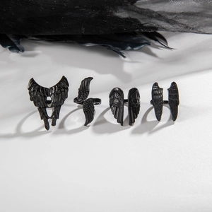 Gothic style four-piece black angel wing ring set with punk feather design for women