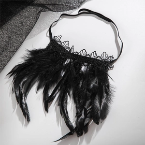 Detail of gothic black feather bracelet with delicate lace trim and elastic band