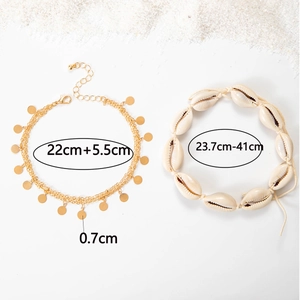 Detail view of adjustable seashell anklet and layered gold chain with size measurements