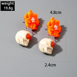 Detail view of punk skull camellia earrings with 19.8g weight and 4.8cm height dimensions