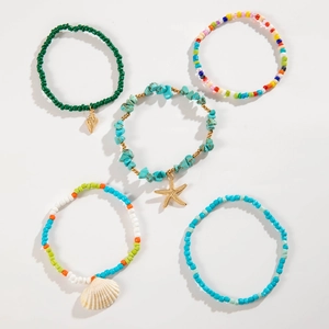 Detailed view of 5-piece bohemian beaded anklet set with starfish and shell charms
