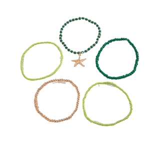 Five-piece bohemian beaded anklet set with starfish charm in green and gold tones