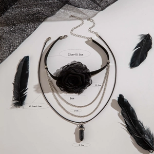 Detail of gothic black rose choker with multi-layer chains and marble stone pendant