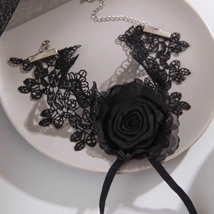 Gothic black lace choker featuring a large 3D rose flower and elegant long ribbons