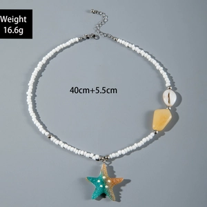 Detail of beach-style beaded necklace with starfish charm and shell on 16.6g 40cm chain