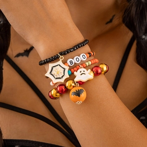 Detailed view of Halloween beaded bracelet set with ghost, bat, and BOO charms on wrist