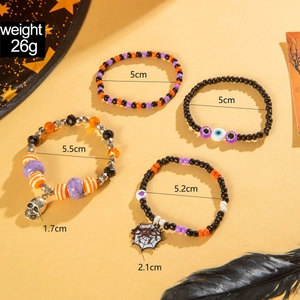 Halloween beaded bracelet set with skull charms and evil eye in orange black and purple