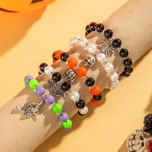 Detailed view of Halloween beaded bracelet set with skull, pumpkin and bat pendants