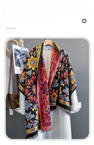 Detailed texture of black imitation cashmere scarf with yellow floral pattern and fringe