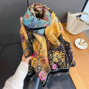 Close-up of bohemian sunflower jacquard scarf with decorative fringe details