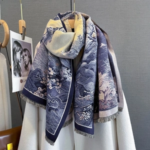 Floral jacquard scarf in navy blue and cream white with tassels on white coat