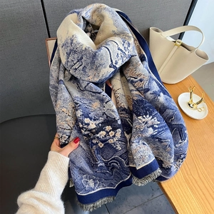 Close-up of floral jacquard pattern and soft fringe edges on high-quality winter scarf