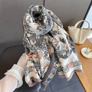 Detailed view of the Toile de Jouy floral landscape print and fine fringe on the scarf