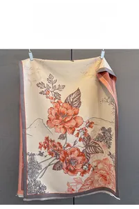 Detail of floral jacquard cashmere-feel scarf with elegant orange flower patterns