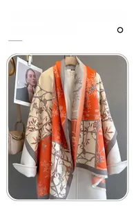 Detail of floral imitation cashmere scarf with contrast stitching and jacquard pattern