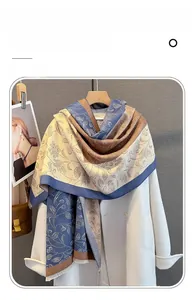 Detailed texture of imitation cashmere scarf with abstract paisley and tassel edges