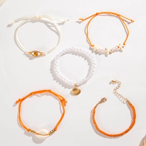 Detail of 5pcs beach bracelet set with evil eye charm, starfish and sea shell motifs