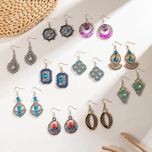 Collection of 10 pairs of bohemian vintage style earrings with floral and geometric patterns