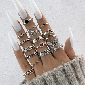 Set of 15 vintage silver rings featuring gothic skull, butterfly, and snake punk designs