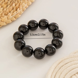Detail view of ethnic beaded bracelet with 5.5cm inner diameter measurement