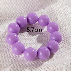 Detail view of ethnic purple beaded bracelet showing the 5.7cm outer diameter size