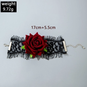 Detail of gothic black lace hand chain with red rose and adjustable silver clasp