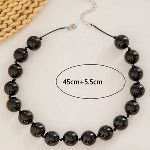 Detail of 45cm black beaded bohemian necklace with silver lobster clasp and extension chain