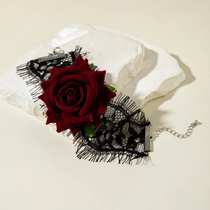 Detail of Gothic lace choker with deep red velvet rose and adjustable metal chain link