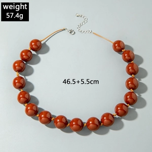 Detail of red-brown resin bead necklace showing lobster clasp and 46.5cm length measurements