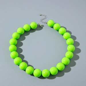 Close-up of vibrant neon green large resin beads with a silver metal lobster clasp