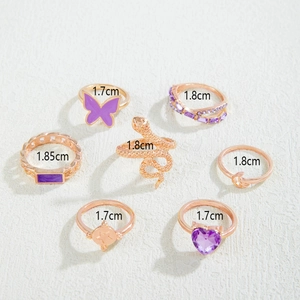 Lot de 7 bagues or rose avec papillon violet, serpent et pierres gemmes violettes