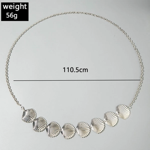 Detail view of silver starfish waist chain with textured scallop pendants, 110.5cm length