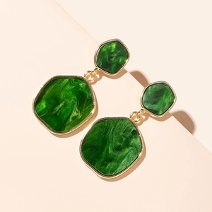 Irregular green resin geometric drop earrings with gold metal frame in a retro style
