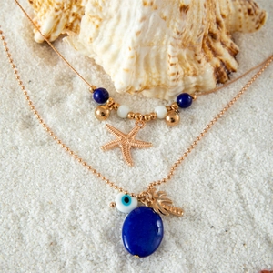 Details von Meeres-Halsketten mit Seestern, Palmenanhängern und Evil-Eye-Perlen