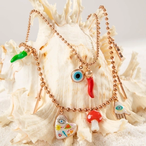 Bohemian multi-pendant rose gold bead necklace with evil eye and chili charms on shell