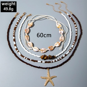 Detail view of Bohemian seashell necklace set featuring starfish pendant and natural stones