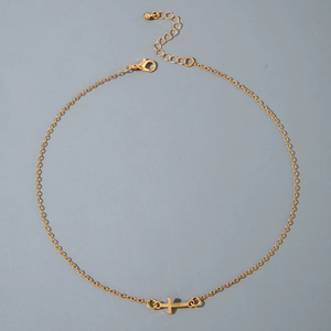 Detailed view of the gold-plated cross necklace with adjustable chain and lobster clasp