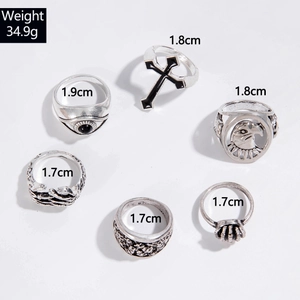 Detailed view of 6-piece punk ring set with cross eagle and skull patterns in antique silver