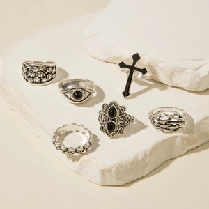 Detailed view of 6-piece vintage silver punk rings featuring skulls and crosses