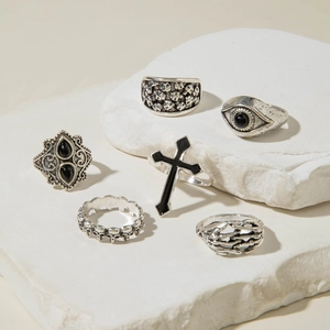 Macro detail of 6-piece vintage silver gothic rings with skulls and eagle on stone