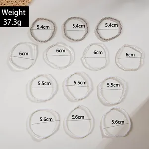 Detailed size chart for 13-piece bohemian bead bracelet set with silver and white tones