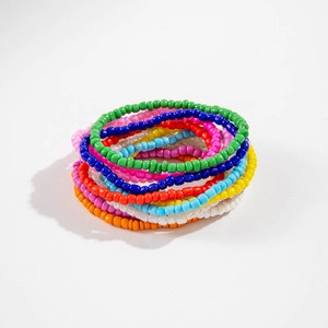Close-up of colorful Bohemian bead bracelets set with high gloss finish and elastic band