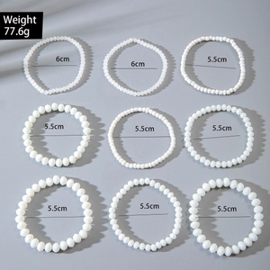 Detailed view of 9-piece white seed bead bracelet set with weight and size specifications