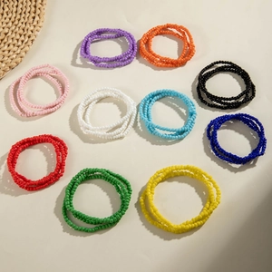 Close-up of bohemian colorful seed bead bracelets in 10 vibrant stackable colors
