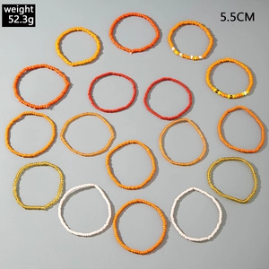 Top view of a 16-piece set of colorful bohemian seed bead bracelets, 5.5cm diameter