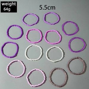 Detail view of 13-piece bohemian seed bead stretch rings with 5.5cm diameter measurement