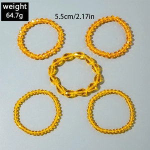 Detail view of 5-piece yellow beaded bracelet set with weight and size specifications