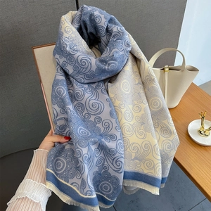 Detail of vintage double-sided jacquard shawl with gray-blue swirling cloud patterns