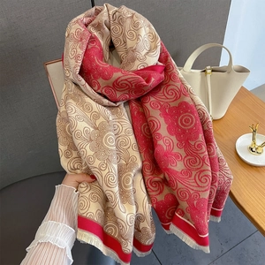 Close-up of vintage paisley cashmere shawl with soft fringes and elegant patterns