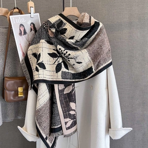 Vintage floral plaid pashmina scarf with fringe styled on a white coat and leather bag